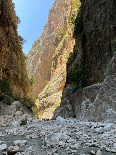 Hikers exploring the stunning Samaria Gorge in Crete, Greece.