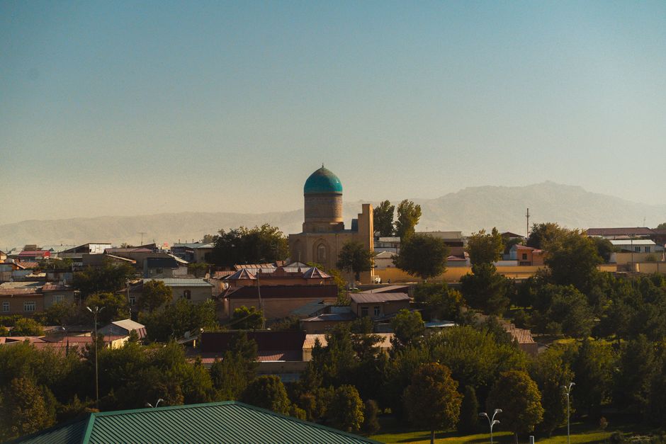 A panoramic view of Samarkand's cityscape with historic architecture and greenery.