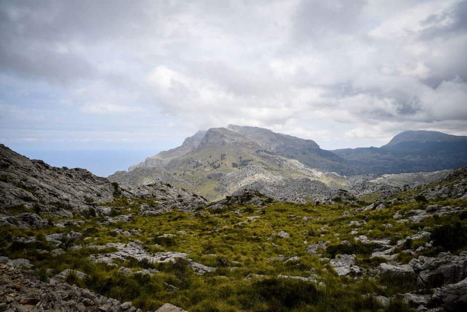 Breathtaking view of the rugged Serra de Tramuntana mountains in Mallorca, Spain under a dramatic sky.