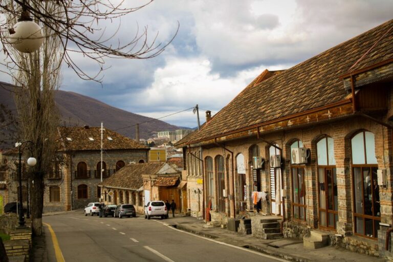 A picturesque street in Şeki, Azerbaijan with historic architecture.