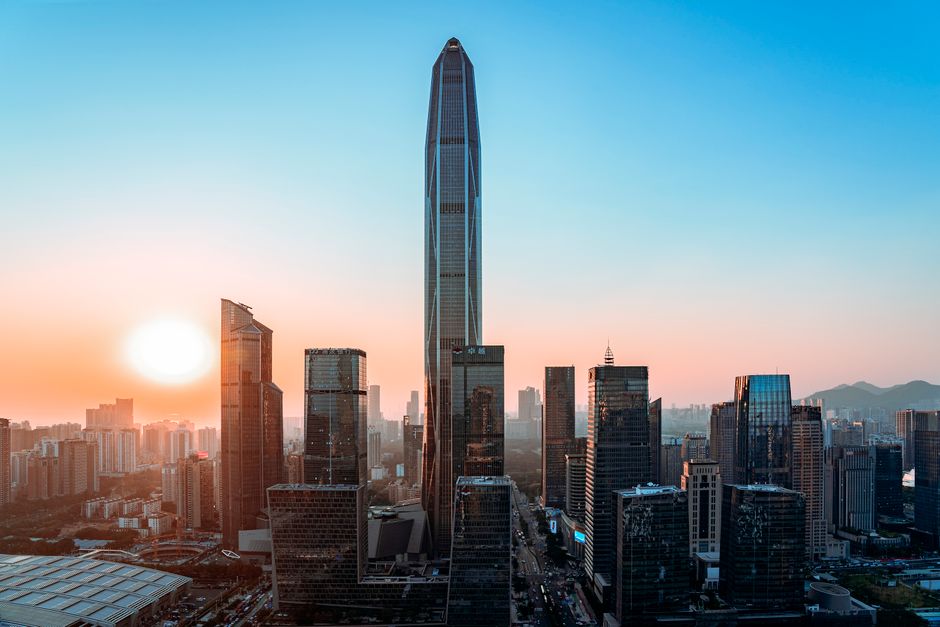 Vibrant Shenzhen skyline with tallest buildings at sunset, showcasing urban development.