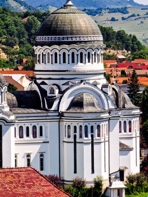 Explore the stunning Neo-Byzantine architecture of a Romanian Orthodox church in Sighișoara, Transylvania.