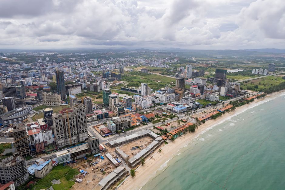 Expansive aerial view capturing Sihanoukville's cityscape and coastline in Cambodia.