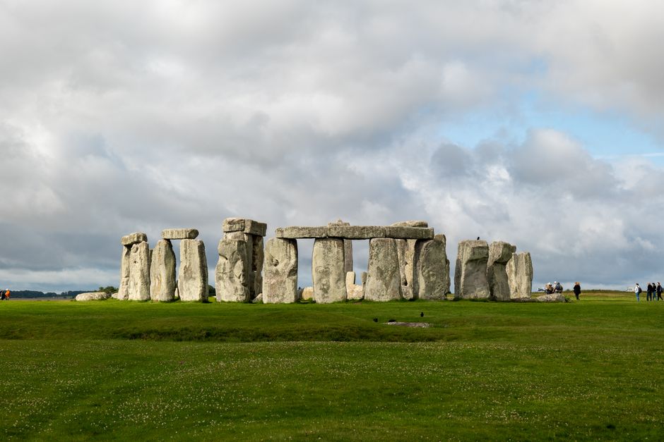 A stunning view of Stonehenge against a backdrop of dramatic clouds.