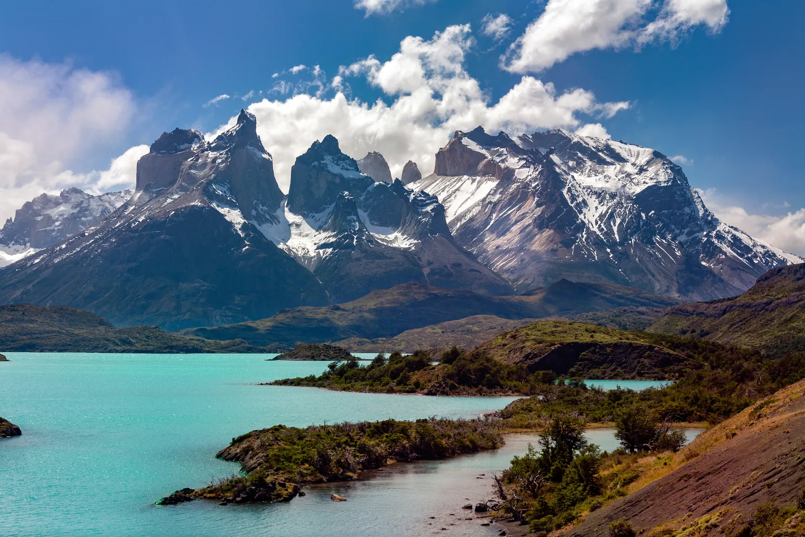 The peaks of Torres del Paine above a turquoise lake, Patagonia, Chile