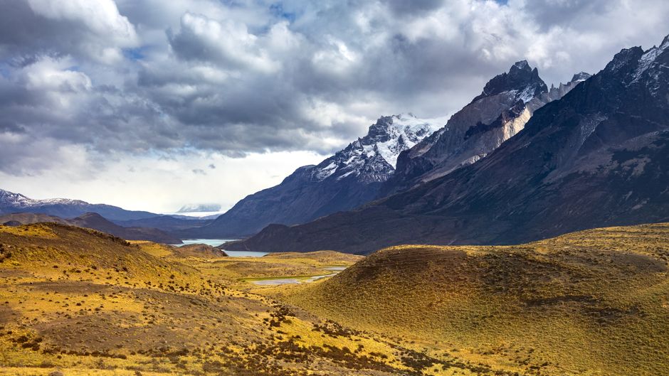 Breathtaking view of Torres del Paine in Chile's Patagonia under dramatic skies.