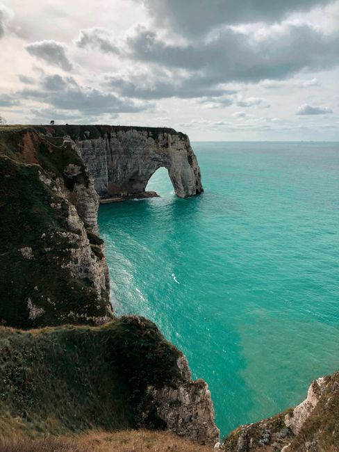 Breathtaking view of the iconic Elephant Rock in Étretat, France under a serene sky.