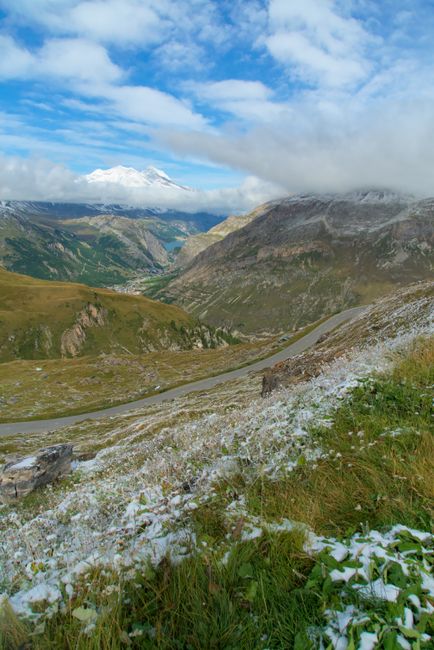 Breathtaking mountain landscape in Val-d'Isère, France, with scenic winding roads and snowy peaks.