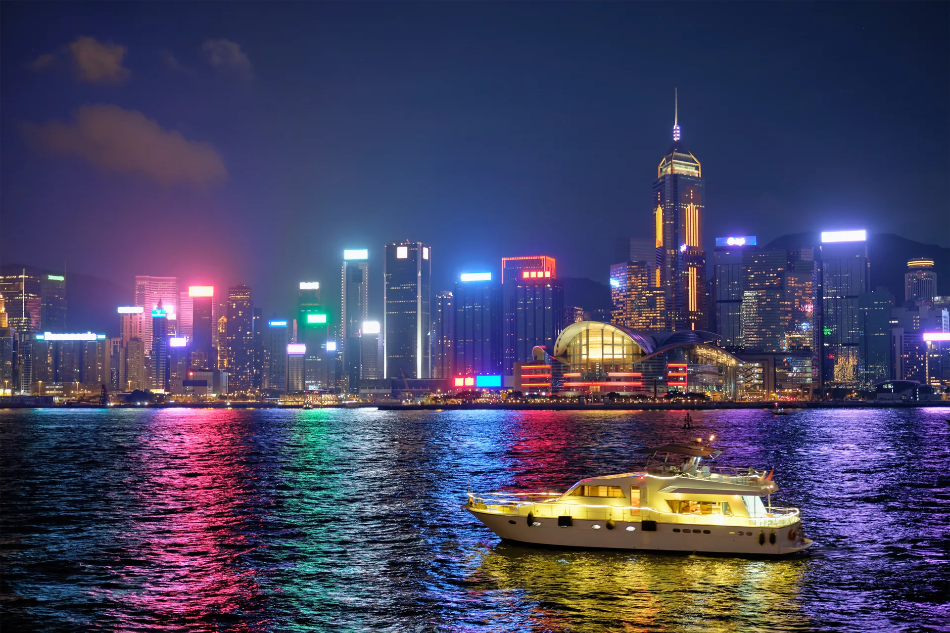 The Hong Kong Island skyline glowing across Victoria Harbour at night