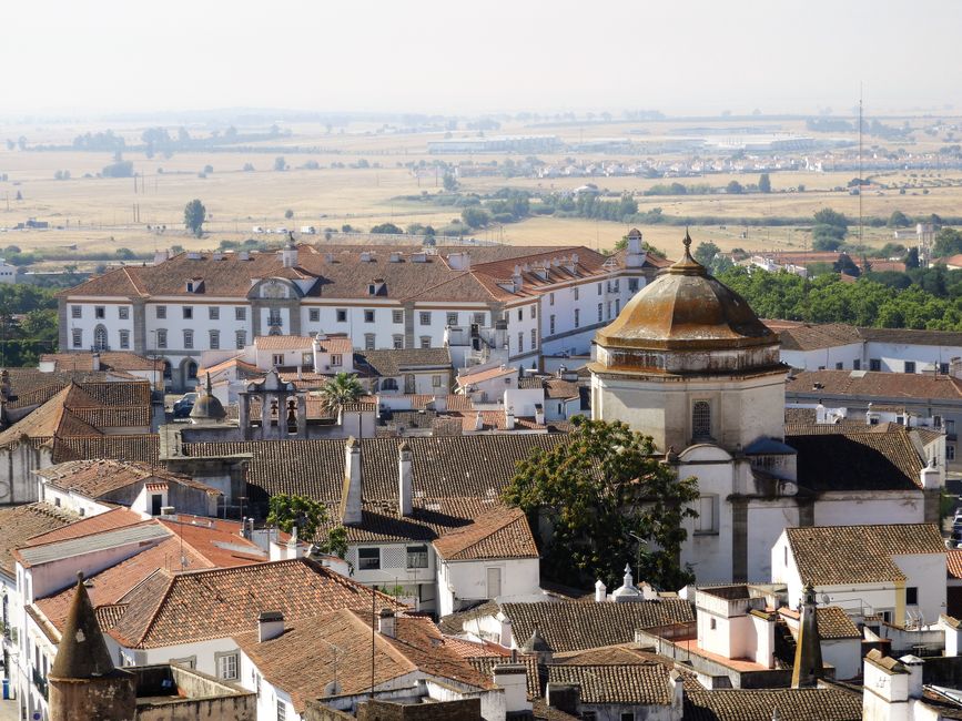 Aerial shot of the picturesque historic town of Evora, Portugal, featuring traditional architecture.