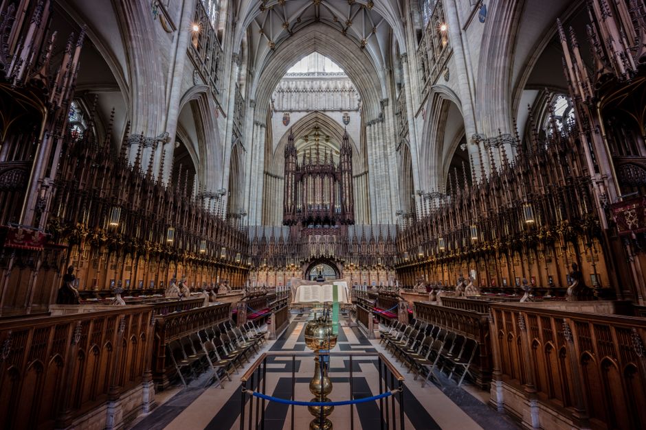 Explore the majestic Gothic architecture of York Minster's ornate choir, showcasing England's rich heritage.