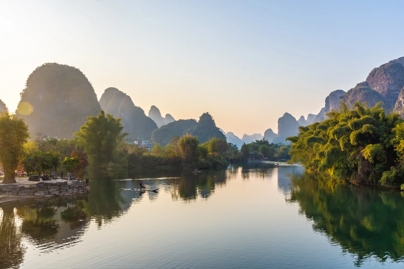 Sunset over the Yulong River and karst mountains in Yangshuo, Guilin, China